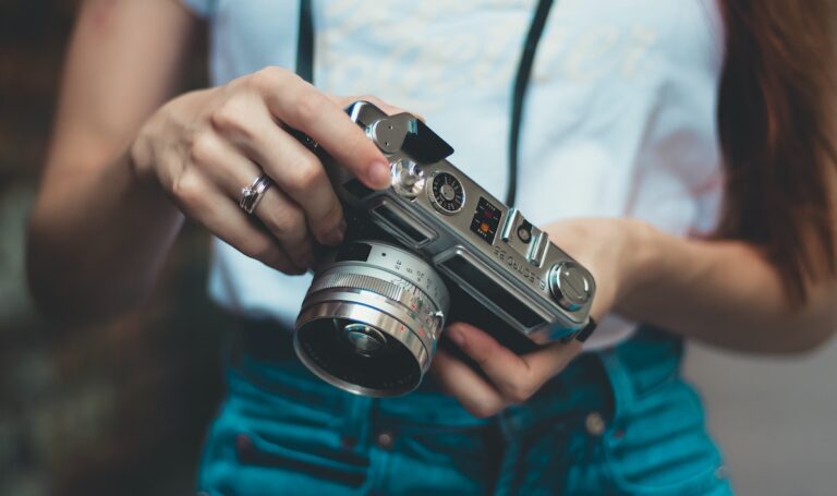 Woman In White Shirt Holding Analog Camera