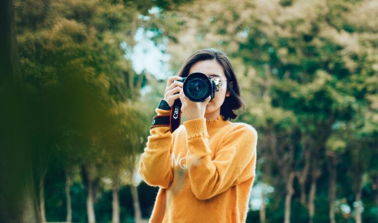 woman holding DSLR camera