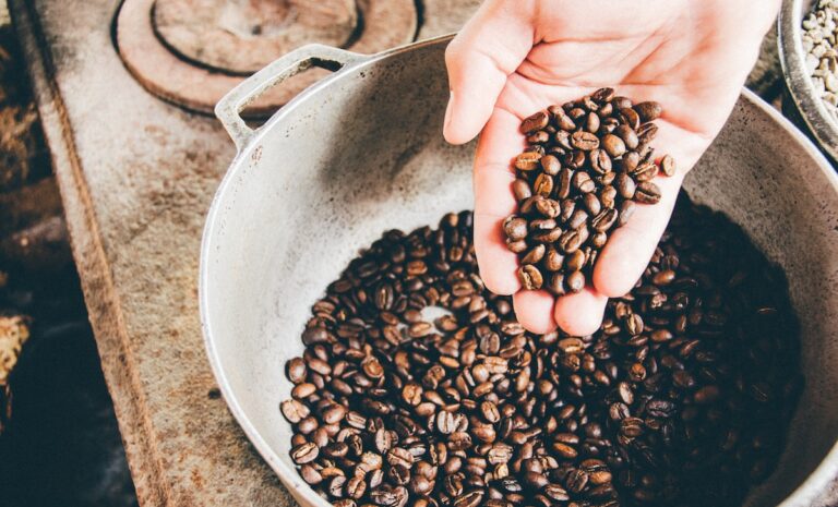 coffee beans on gray steel wok