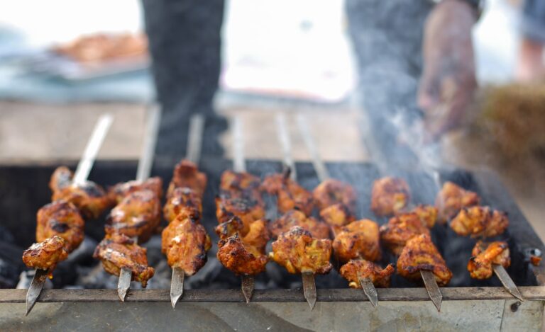 grilled meat on charcoal grill